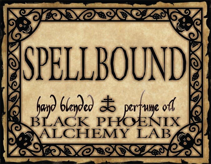 Label for 'Spellbound' hand blended perfume oil by Black Phoenix Alchemy Lab with decorative border.