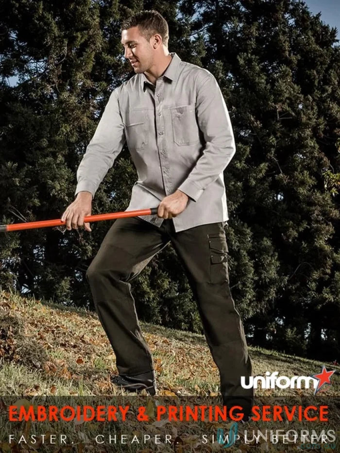 Man wearing Syzmik mens lightweight tradie long sleeve cotton twill shirt in work mode