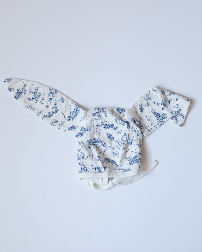 Blue and white toile bonnet with bunny ears.