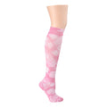 Knee-high compression socks in a pink tie-dye pattern with a textured finish.