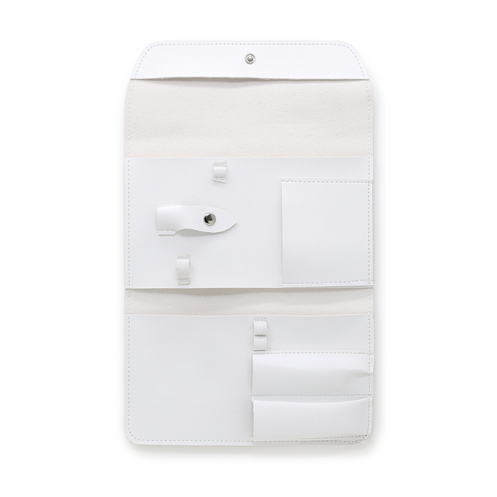 White manicure tool case open showing empty tool pockets and pouch