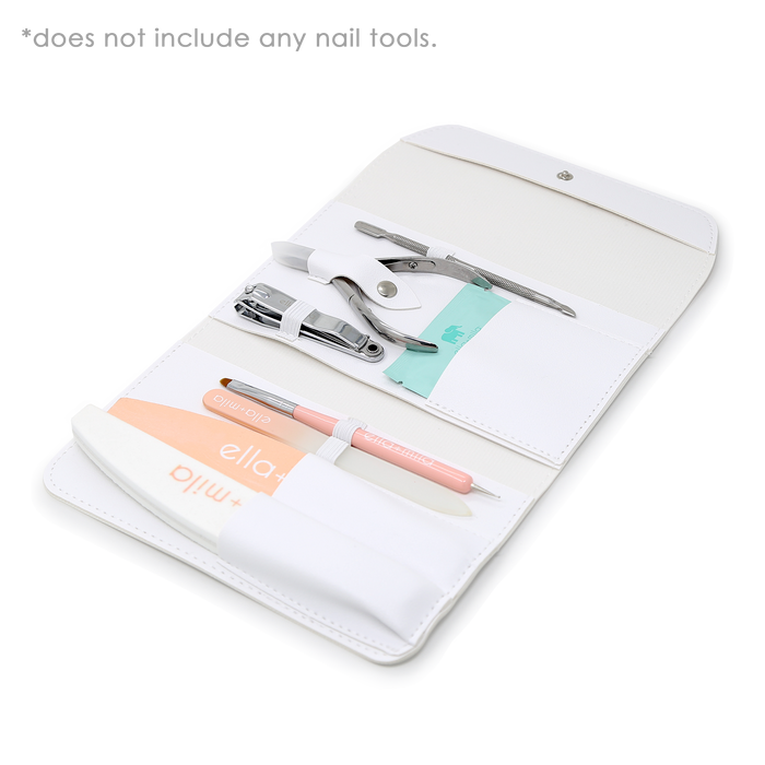 White manicure tool case open with nail tools, files and buffer displayed
