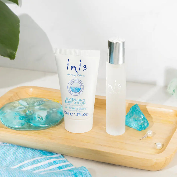 cologne and body lotion on a wooden tray with a plant in the background