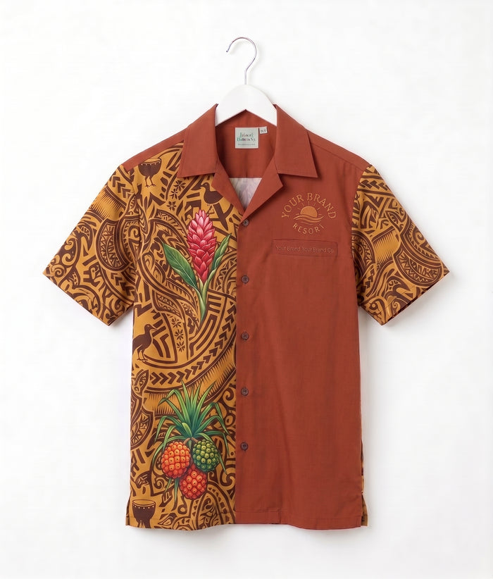 A short-sleeve button-up camp shirt hanging on a white hanger against a white background. The shirt features a split design: one side is rust orange with a subtle 'YOUR BRAND VISION' chest print, while the other side displays a detailed brown Polynesian tribal pattern with a red flower and green pineapple graphic.