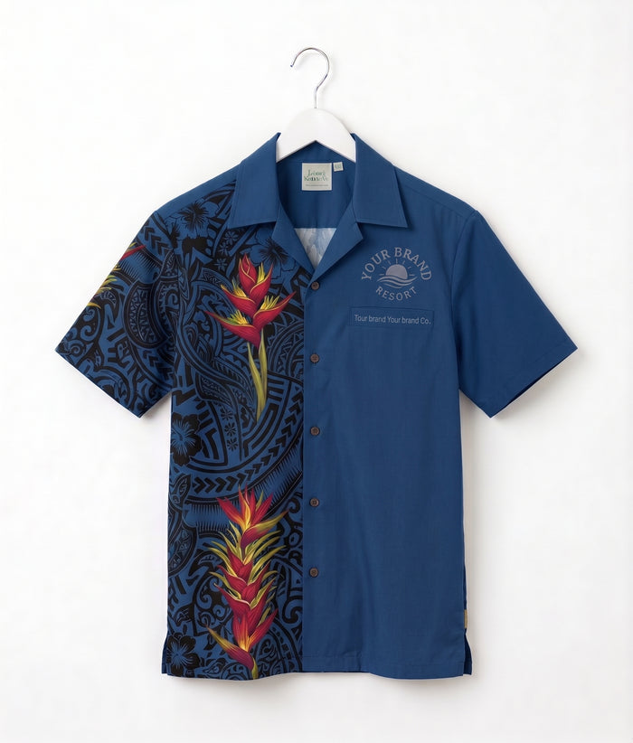 A short-sleeve button-up camp shirt hanging on a white hanger against a white wall. The shirt features a split design: one half is solid medium blue with a small white printed logo on the chest, and the other half has a black background with a colorful tropical floral and Polynesian pattern.