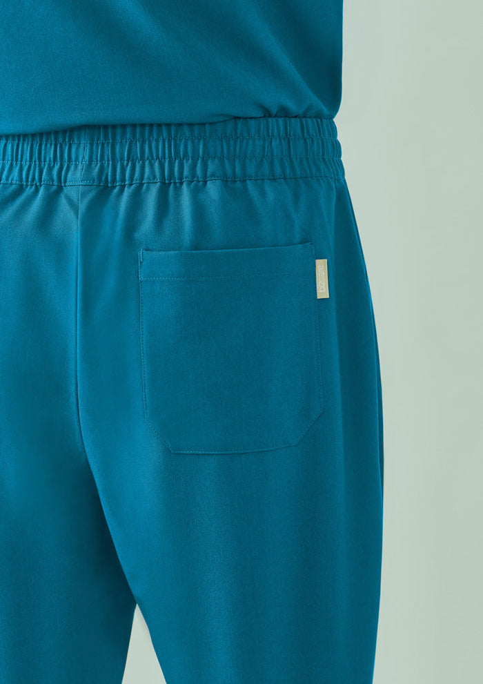 Back view of unisex Pulse straight leg scrub pant in teal with elastic waist