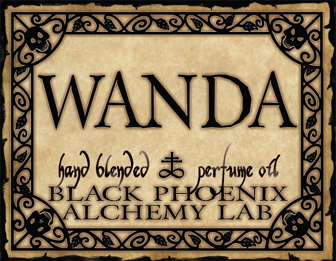 Label for 'Wanda' hand blended perfume oil by Black Phoenix Alchemy Lab with decorative border.
