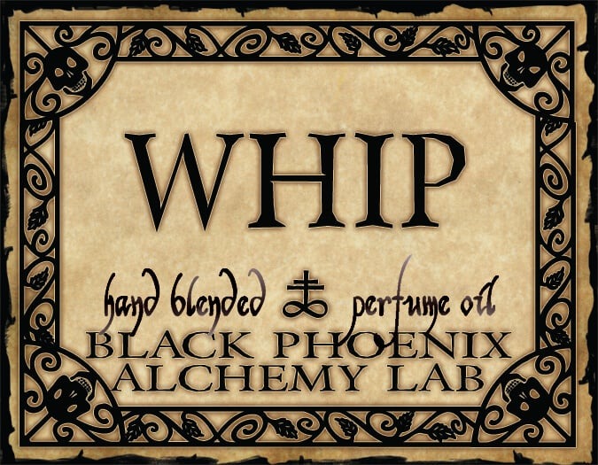 Label for 'WHIP' hand blended perfume oil by Black Phoenix Alchemy Lab with decorative border and text.